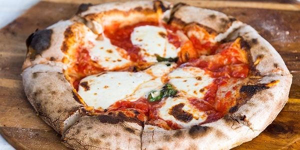 The origins of pizza can be traced back to 18th century Naples.