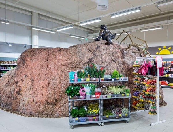 The construction company, which had already invested a colossal amount into the project, was left with only one option: to construct the shopping mall around the rock.