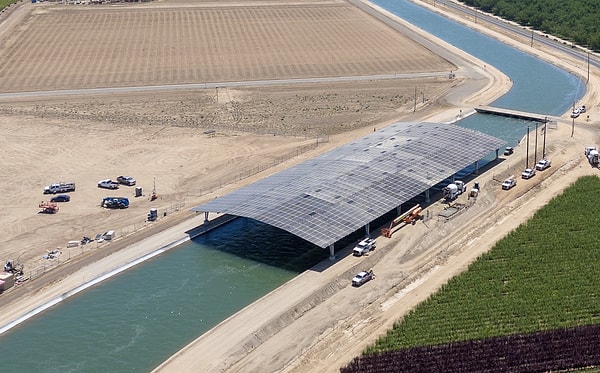 Experts are highlighting the strategic benefits of installing solar panels over state-owned water canals, rather than deploying them on unused agricultural lands.
