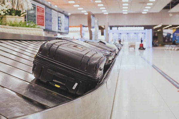 Dark-colored suitcases easily get mixed up on the luggage carousel.