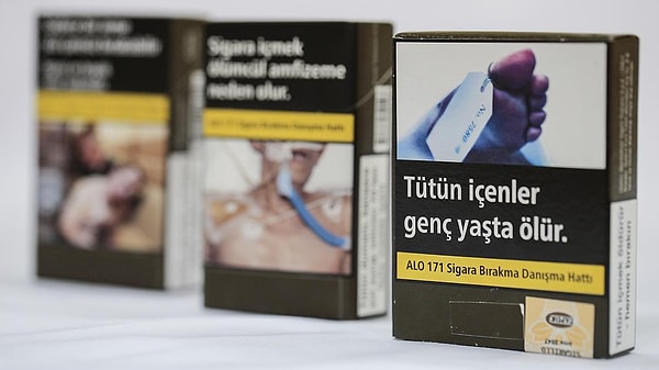 Her paket sigaradan 20 lira, açık tütünün kilosundan 100 lira kesilecek.